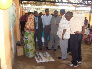 The District Commissioner (right) looking at the presentations of local farmers and talking with the director of the Agricultural services. (Photo: Claude Bourdin)